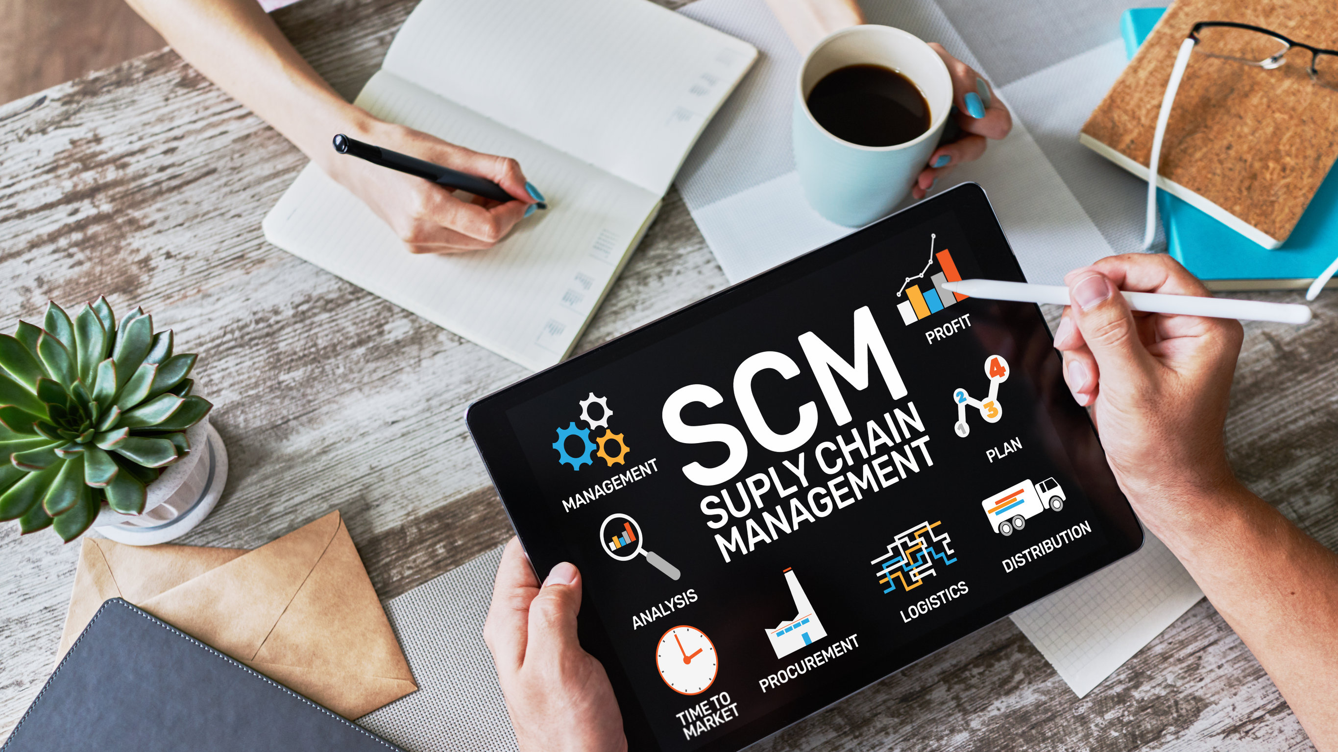 SCM - Supply Chain Management and business strategy concept on an iPad screen.